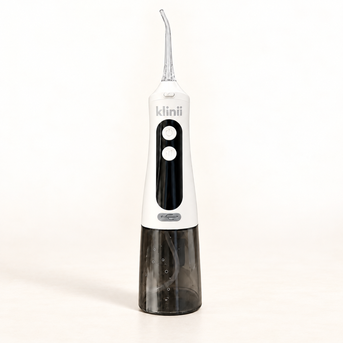 White Klinii Water Flosser on a soft white and ivory background